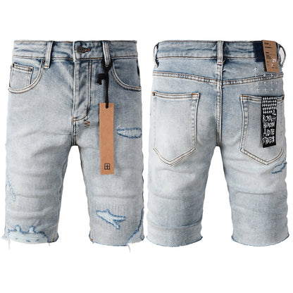 Men's Vintage Light Wash Ripped Denim Shorts with Raw Cut Hem and Distressed Details 2003