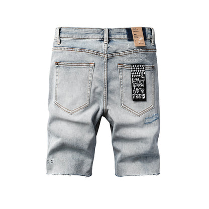 Men's Vintage Light Wash Ripped Denim Shorts with Raw Cut Hem and Distressed Details 2003
