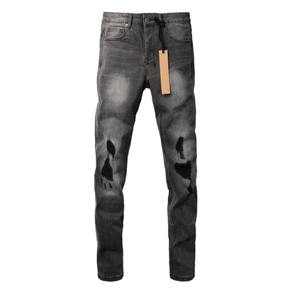 Urban Gray Ripped Jeans with Bold Black Graffiti Accents 3003